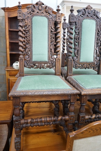 A set of six 19th century Carolean style carved oak dining chairs and one other similar chair (7)